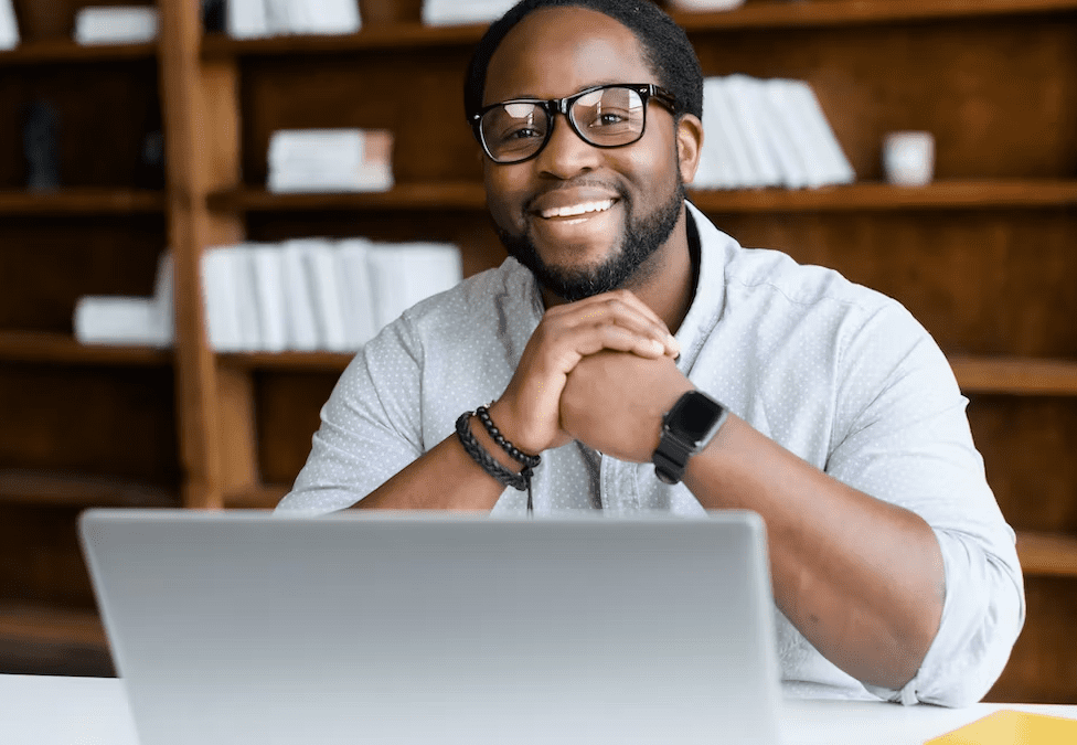 Excited man using secure e-commerce platform on laptop